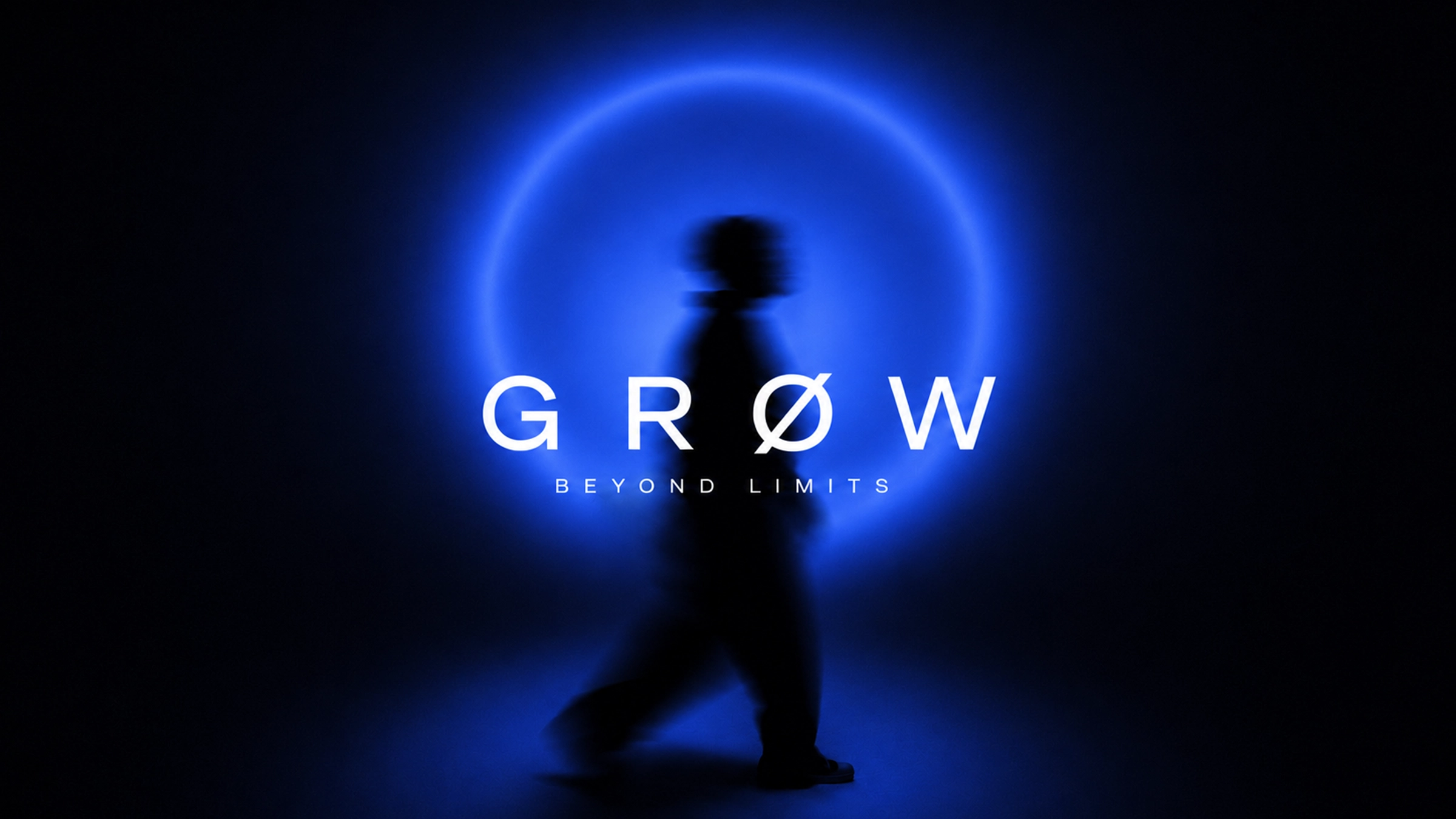 Grow beyond limits — a silhouette walking through a blue halo of light